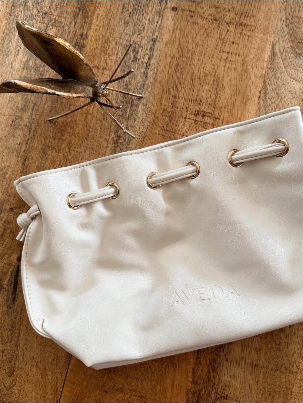 AVEDA Cream Drawstring Cosmetic Pouch with Gold Grommets